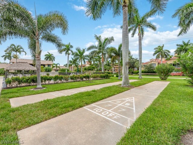 view of community featuring a yard