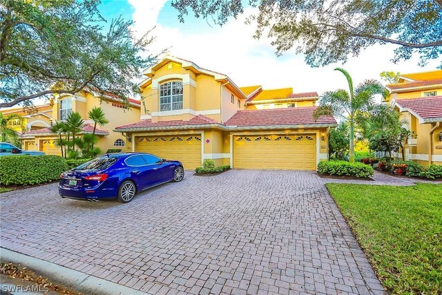 mediterranean / spanish house featuring a garage