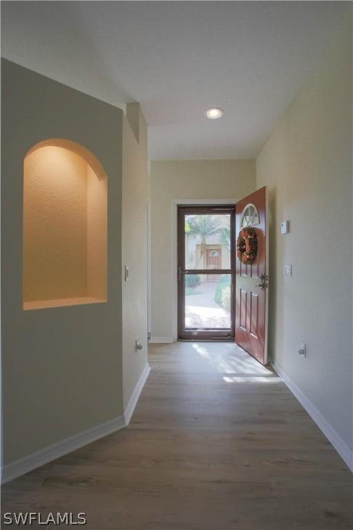 hall featuring wood-type flooring