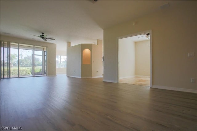 empty room featuring ceiling fan and hardwood / wood-style floors