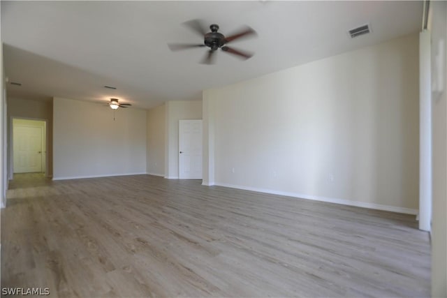 empty room featuring light hardwood / wood-style flooring and ceiling fan