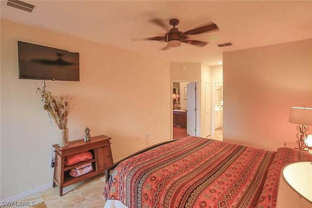 tiled bedroom with ensuite bathroom and ceiling fan