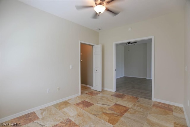 empty room featuring ceiling fan