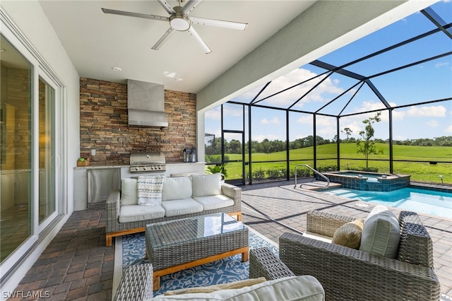 sunroom featuring ceiling fan