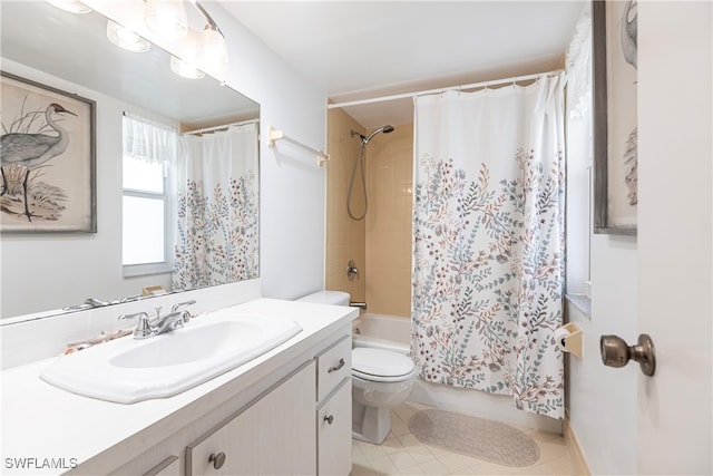 full bathroom featuring vanity, tile patterned floors, toilet, and shower / tub combo