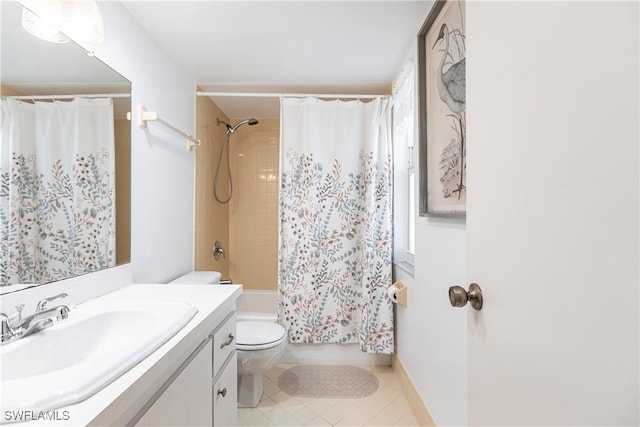 full bathroom featuring shower / bath combo with shower curtain, tile patterned floors, toilet, and vanity