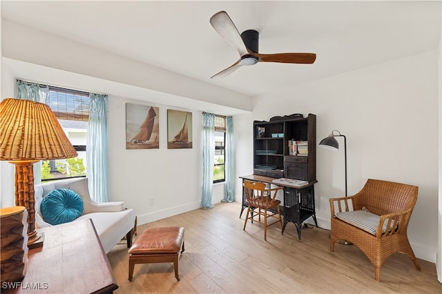 office space featuring light wood-type flooring and ceiling fan