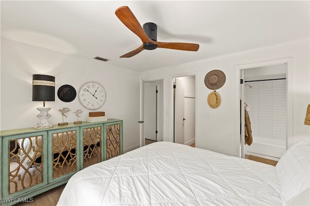 bedroom featuring ensuite bathroom, ceiling fan, and hardwood / wood-style floors