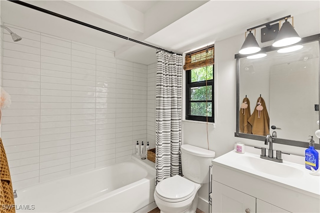 full bathroom with shower / bath combo with shower curtain, toilet, and vanity