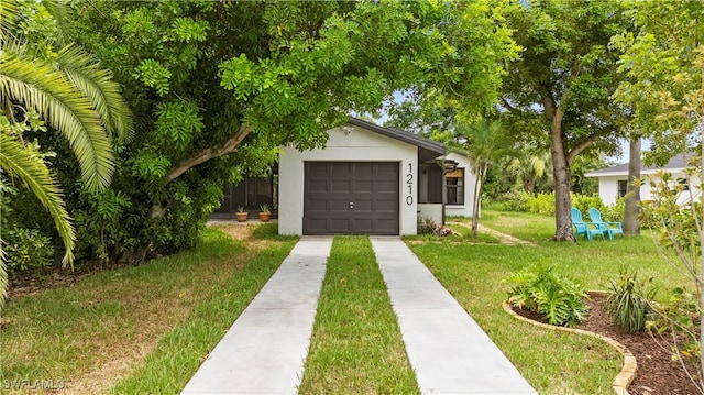 garage featuring a yard