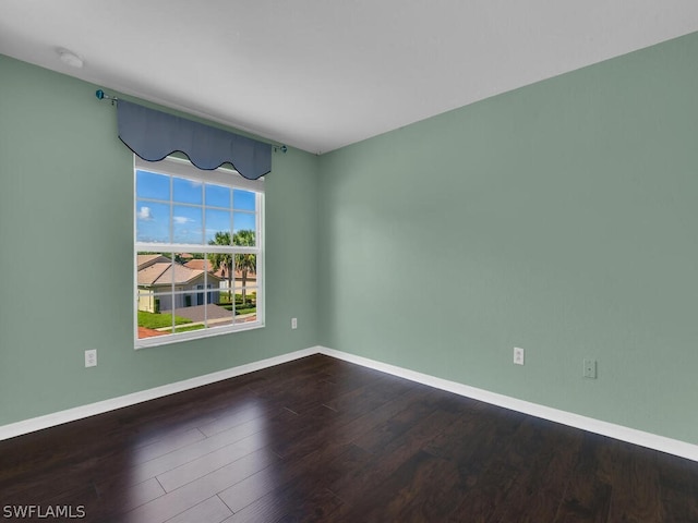 spare room featuring hardwood / wood-style flooring