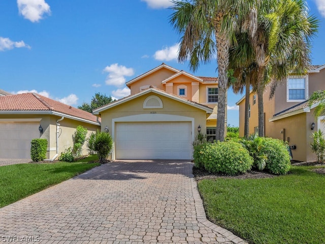 view of front of house featuring a front yard and a garage