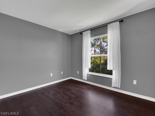 spare room with hardwood / wood-style floors