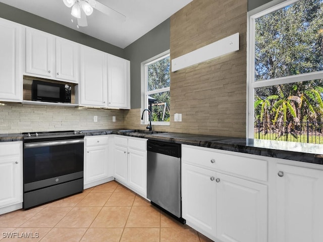 kitchen featuring ceiling fan, sink, tasteful backsplash, white cabinets, and appliances with stainless steel finishes