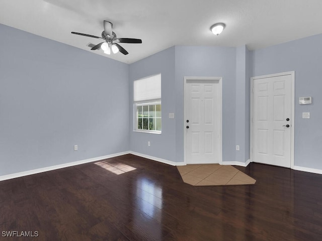 entryway with dark hardwood / wood-style flooring and ceiling fan