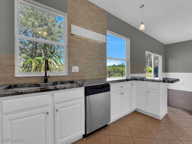 kitchen featuring dishwasher, white cabinets, decorative light fixtures, and sink