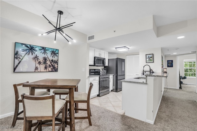 interior space featuring sink and an inviting chandelier