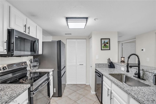 kitchen featuring visible vents, a sink, stainless steel microwave, electric range oven, and dishwasher