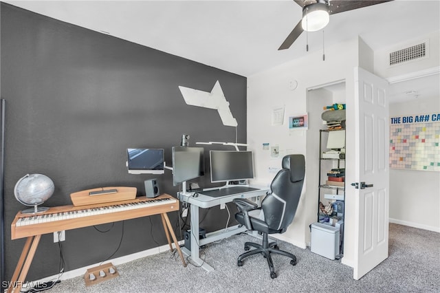 carpeted office featuring ceiling fan