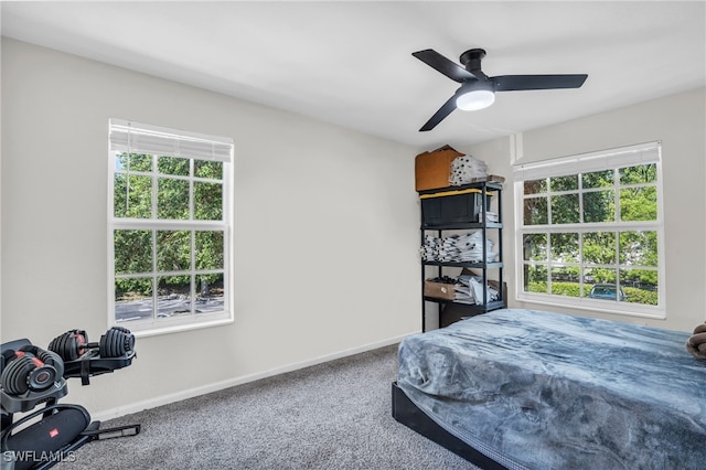 carpeted bedroom featuring ceiling fan