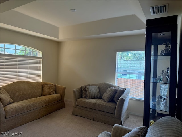 living room featuring a healthy amount of sunlight and carpet floors