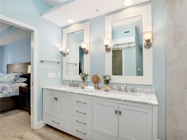 bathroom featuring vanity and hardwood / wood-style floors