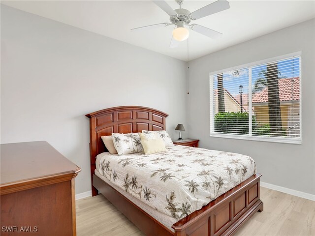 bedroom featuring light wood-type flooring and ceiling fan