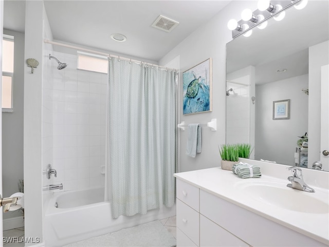 bathroom with tile patterned flooring, vanity, and shower / bath combination with curtain