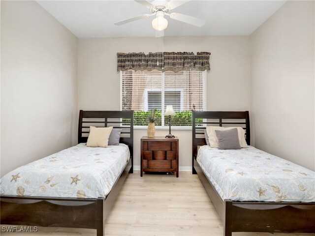 bedroom featuring light wood-type flooring and ceiling fan