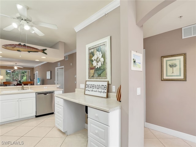 kitchen with sink, white cabinetry, light tile patterned floors, crown molding, and stainless steel dishwasher