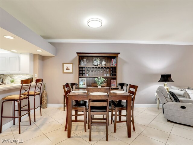 tiled dining area with ornamental molding