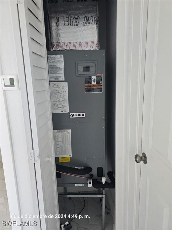 utility room featuring heating unit