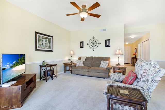 living room with light carpet and ceiling fan