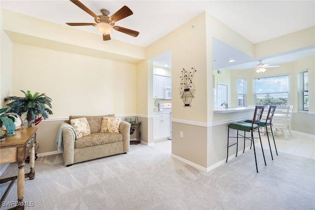 interior space with ceiling fan