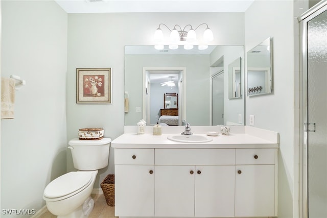 bathroom with vanity, tile patterned flooring, and toilet