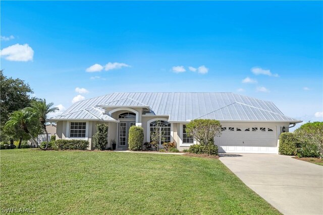 view of front facade featuring a garage and a front lawn