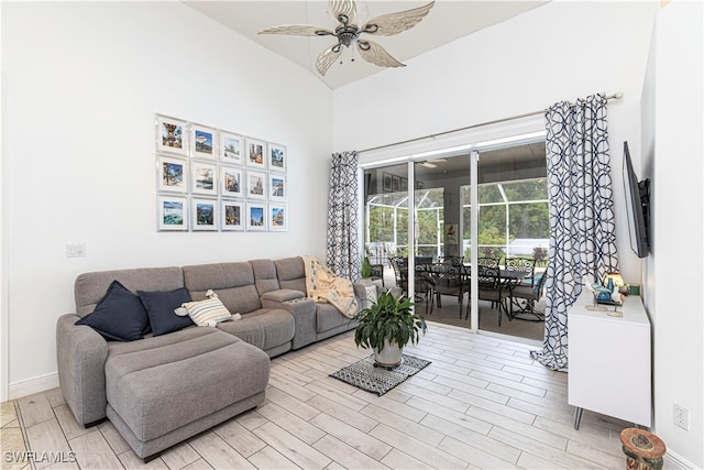 living room featuring lofted ceiling and ceiling fan