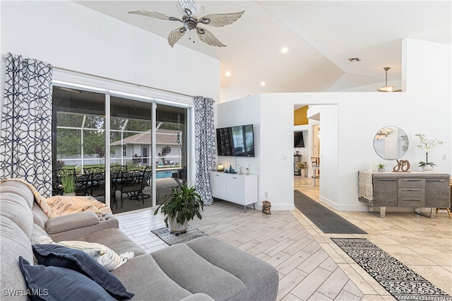 living room with ceiling fan and lofted ceiling