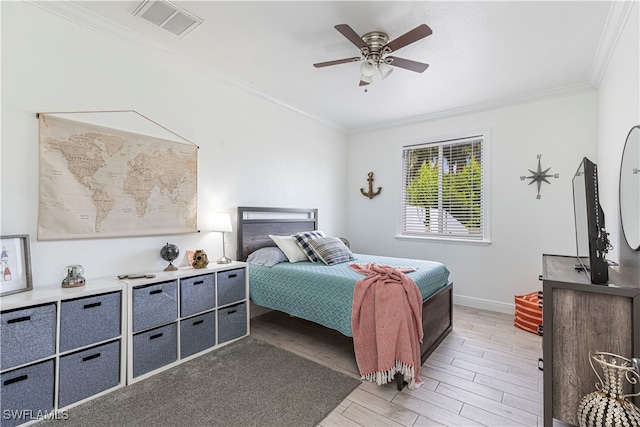 bedroom featuring ornamental molding and ceiling fan