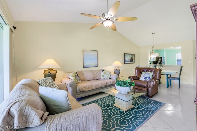 tiled living room featuring high vaulted ceiling and ceiling fan