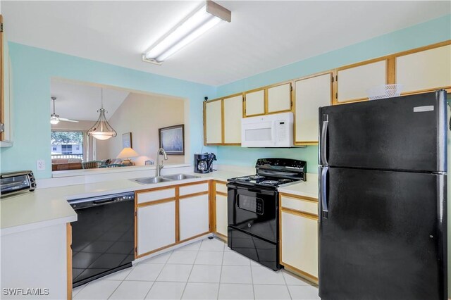 kitchen with light tile patterned floors, ceiling fan, black appliances, hanging light fixtures, and sink