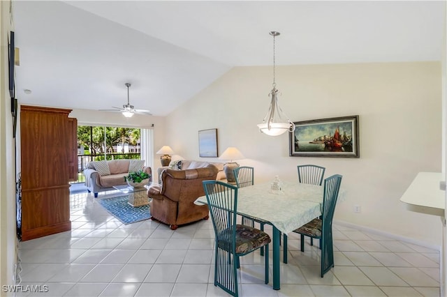 dining room featuring lofted ceiling, light tile patterned flooring, ceiling fan, and baseboards