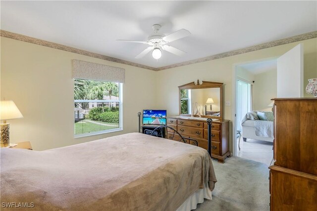 bedroom with light colored carpet and ceiling fan