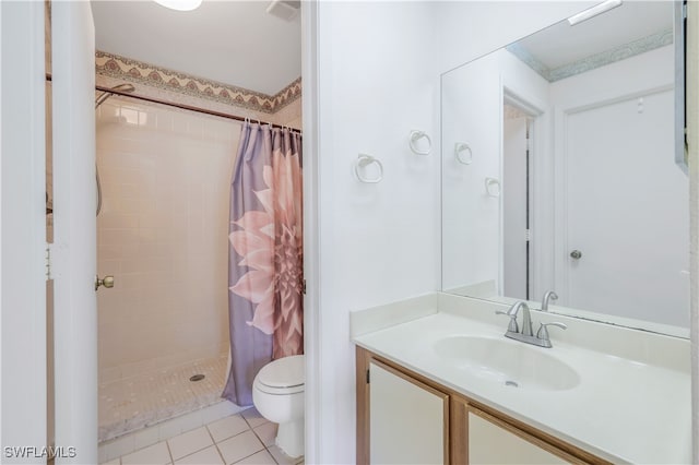 bathroom with tile patterned floors, vanity, a shower with shower curtain, and toilet