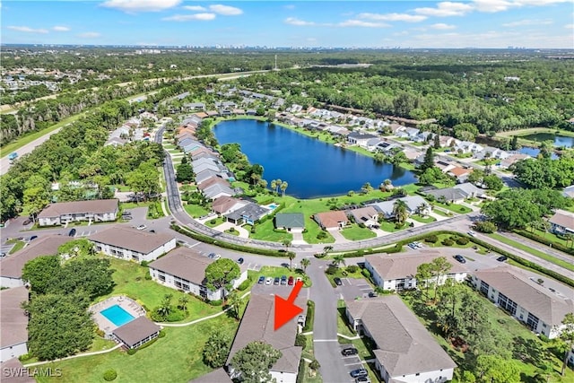 birds eye view of property featuring a water view and a residential view