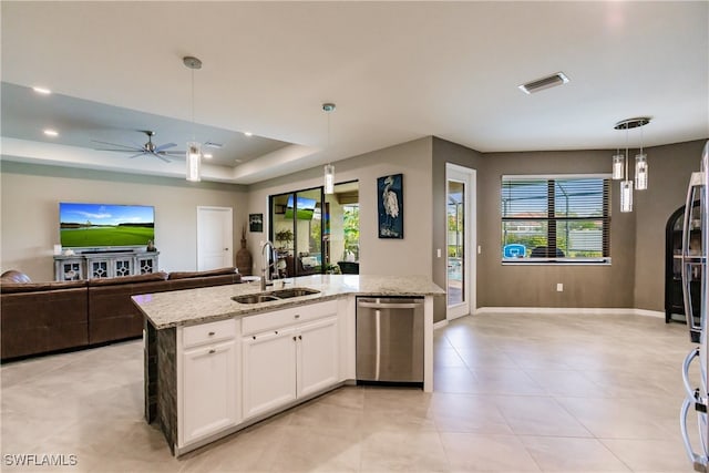 kitchen with ceiling fan, white cabinets, dishwasher, a center island with sink, and light tile patterned floors