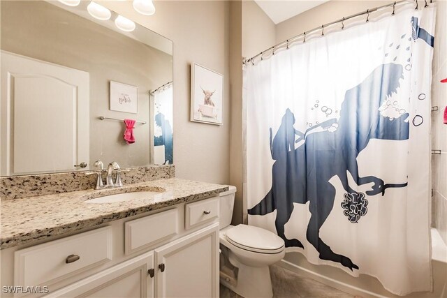 full bathroom featuring tile patterned floors, vanity, toilet, and shower / bath combination with curtain