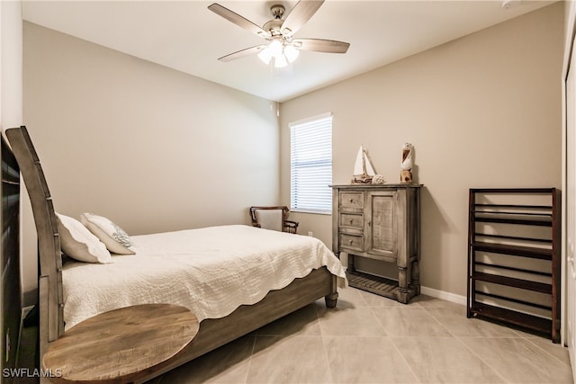 bedroom featuring light tile patterned floors and ceiling fan