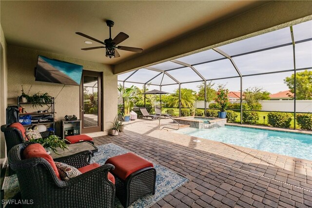 view of swimming pool featuring a patio, an in ground hot tub, ceiling fan, and glass enclosure