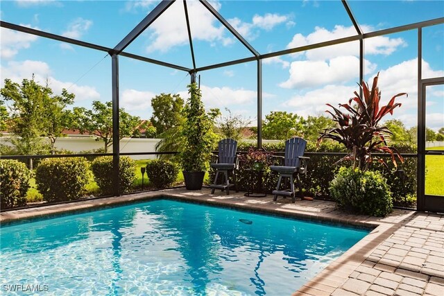 view of pool featuring a patio and a lanai